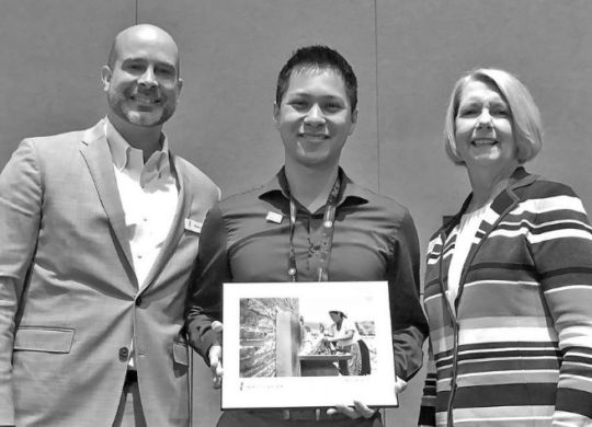Patrick Hayes, Water For People Chief Development Officer (left), and Maureen A. Stapleton, Water for People Independent Director (right), present Gabriel Rodriguez, Water Resources Project Engineer at Bennett Engineering Services (left), with the Kenneth J. Miller Founders’ Award 2018.