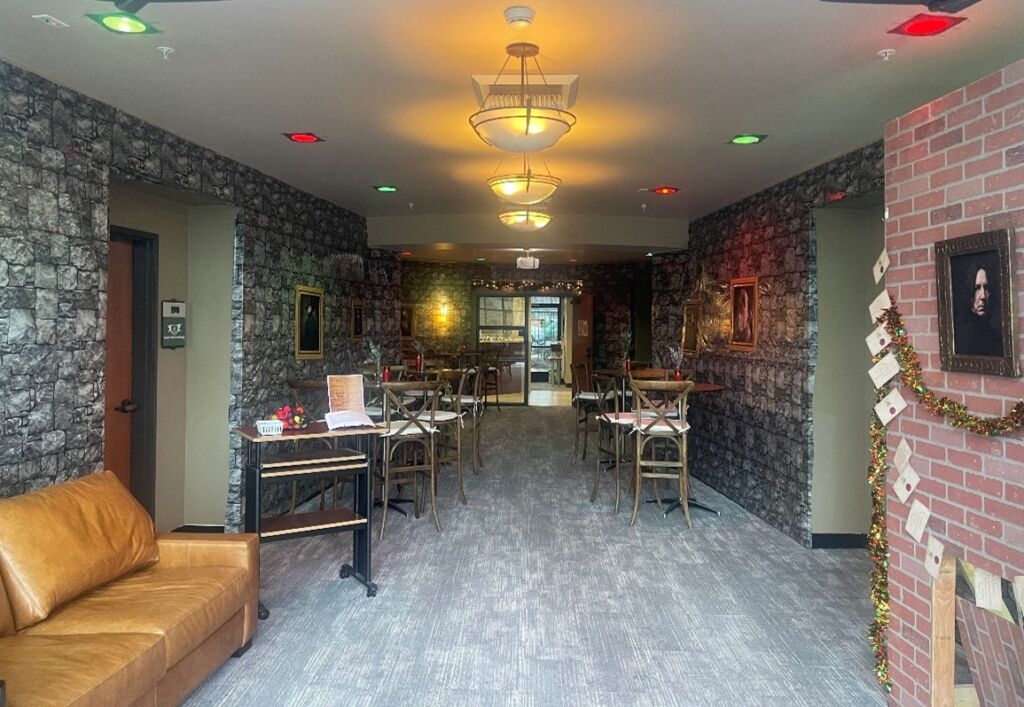 Decorated office lobby with Harry Potter wallpapers and other decorations.